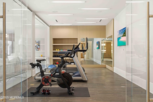 27 N Ward Ave, Rumson, NJ 07760 - exercise room featuring baseboards, built in features, and wood finished floors