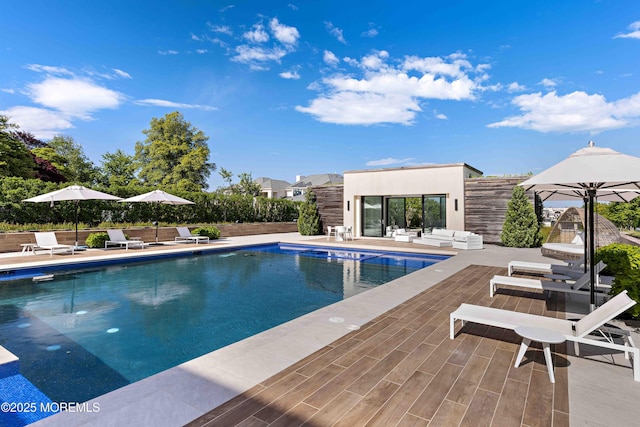 27 N Ward Ave, Rumson, NJ 07760 - view of pool featuring an outbuilding, a storage structure, a patio area, and an outdoor hangout area