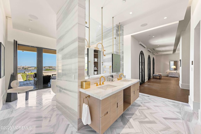27 N Ward Ave, Rumson, NJ 07760 - bathroom with double vanity, recessed lighting, and baseboards