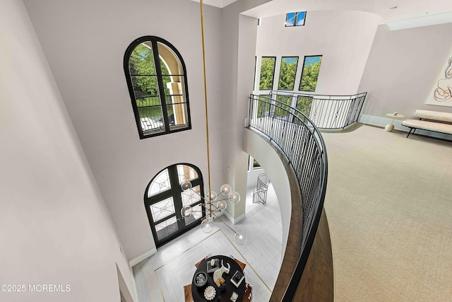27 N Ward Ave, Rumson, NJ 07760 - foyer featuring a towering ceiling, baseboards, carpet, and french doors