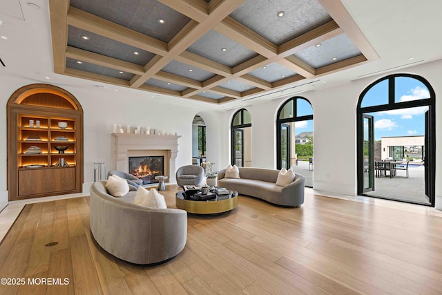 27 N Ward Ave, Rumson, NJ 07760 - living room featuring a high end fireplace, light wood-style floors, coffered ceiling, beam ceiling, and baseboards