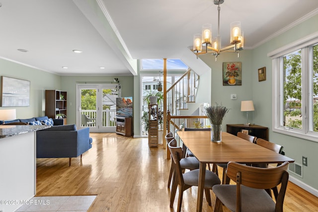 7 Beach Blvd, Highlands, NJ 07732 - dining room with ornamental molding, light wood finished floors, stairs, a chandelier, and baseboards