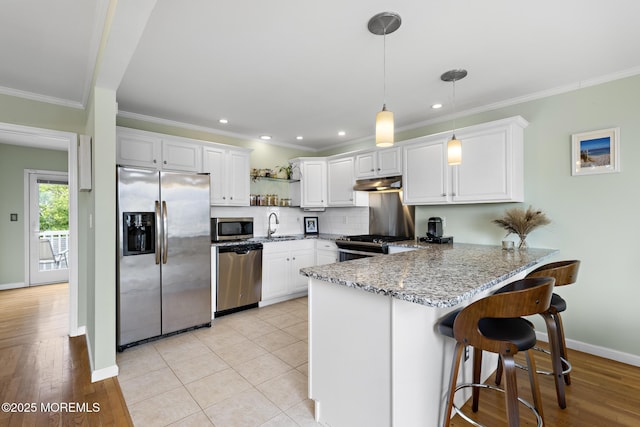 7 Beach Blvd, Highlands, NJ 07732 - kitchen featuring appliances with stainless steel finishes, under cabinet range hood, a peninsula, a sink, and open shelves