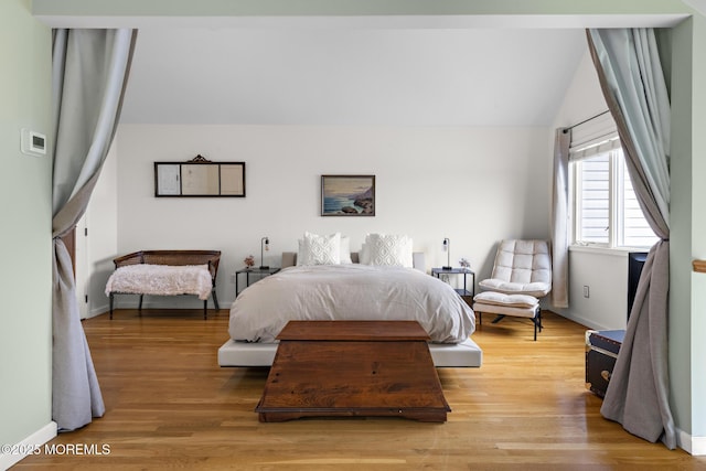 7 Beach Blvd, Highlands, NJ 07732 - bedroom with light wood finished floors, vaulted ceiling, and baseboards