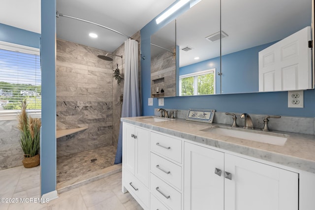 7 Beach Blvd, Highlands, NJ 07732 - full bath with tiled shower, marble look tiles, double vanity, and recessed lighting