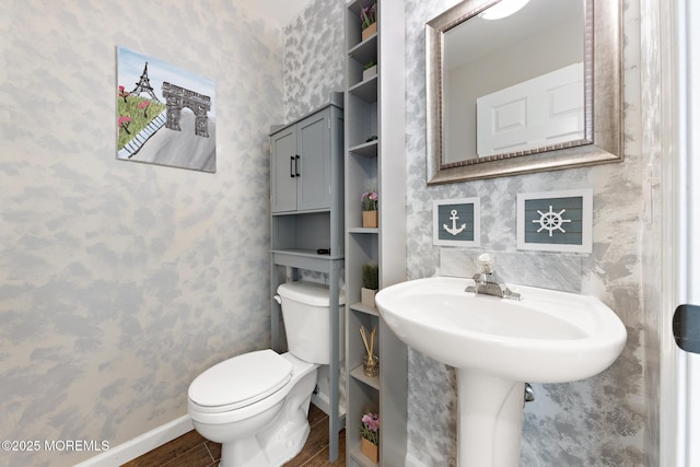 7 Beach Blvd, Highlands, NJ 07732 - half bathroom with wood finished floors, toilet, wallpapered walls, and baseboards