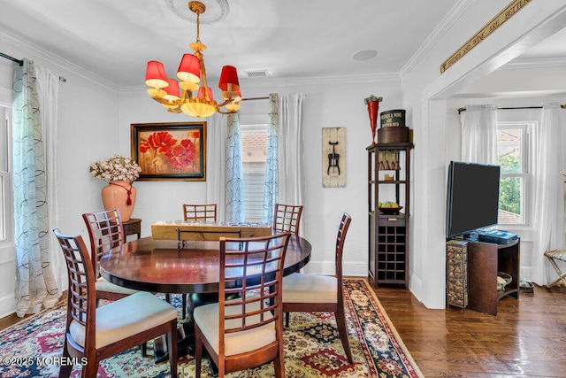 1102 5th Ave, Asbury Park, NJ 07712 - dining room featuring a chandelier, wood finished floors, ornamental molding, and baseboards