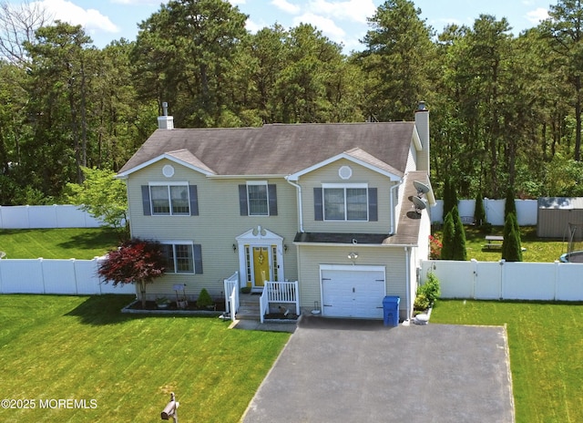 516 Montgomery Ave, Toms River, NJ 08757 - traditional home with a chimney, driveway, and an attached garage