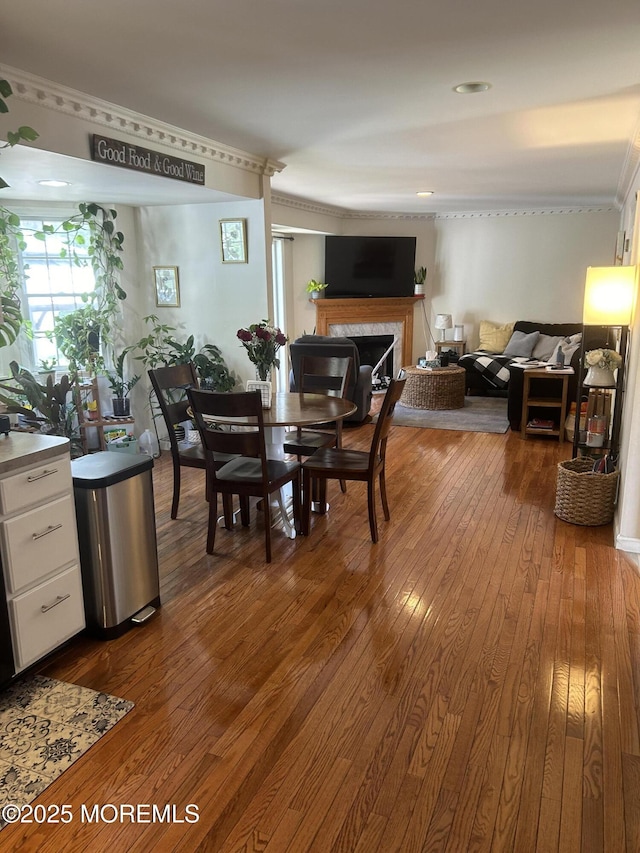 516 Montgomery Ave, Toms River, NJ 08757 - dining area featuring dark wood finished floors, ornamental molding, and a premium fireplace