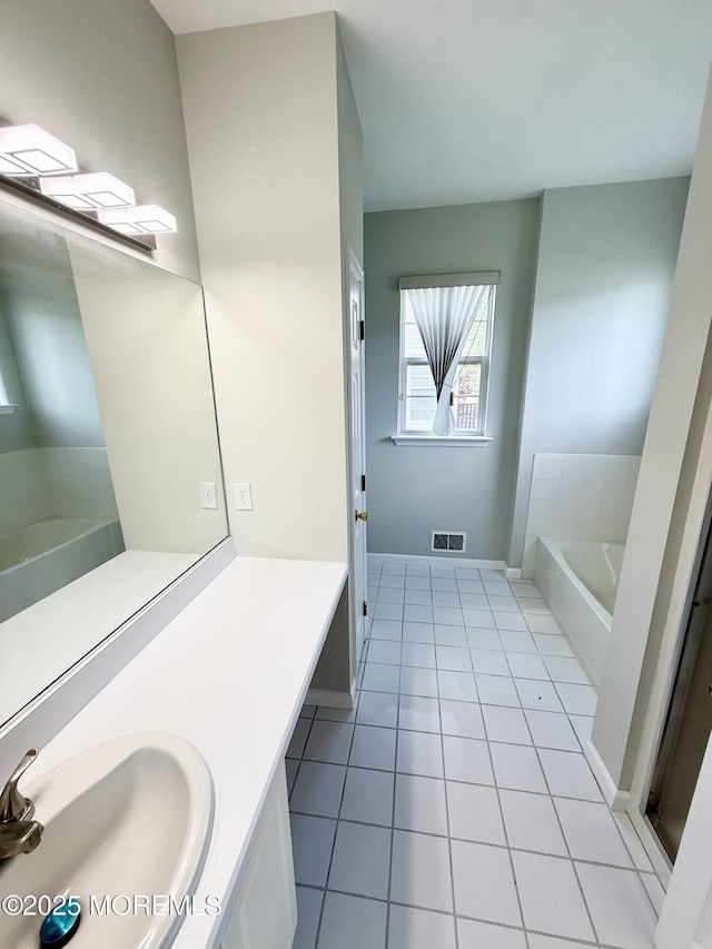 37 Tennyson Rd, Brick, NJ 08724 - bathroom featuring tile patterned flooring, a bath, vanity, and baseboards
