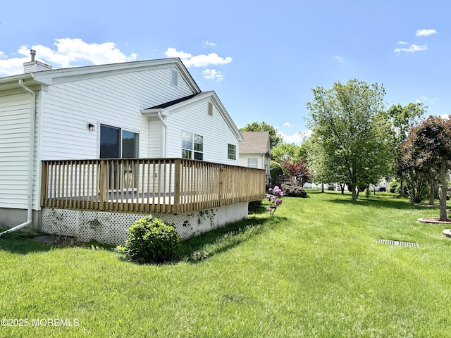 37 Tennyson Rd, Brick, NJ 08724 - view of side of property with a deck, a lawn, and a chimney