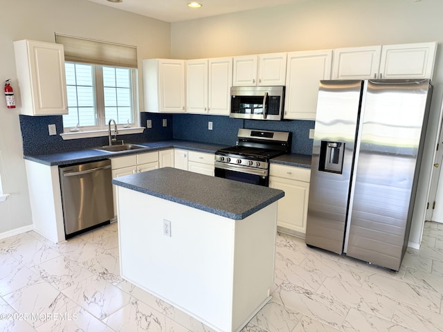 37 Tennyson Rd, Brick, NJ 08724 - kitchen featuring stainless steel appliances, a sink, light marble finish floors, dark countertops, and recessed lighting