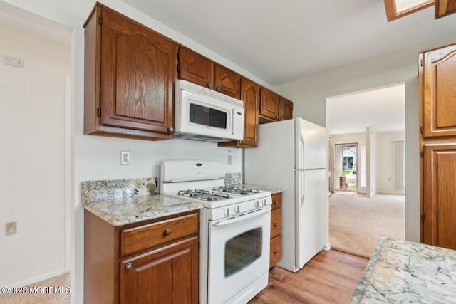 1524 Quince Pl, Toms River, NJ 08755 - kitchen with white appliances, light wood-style flooring, brown cabinetry, and baseboards