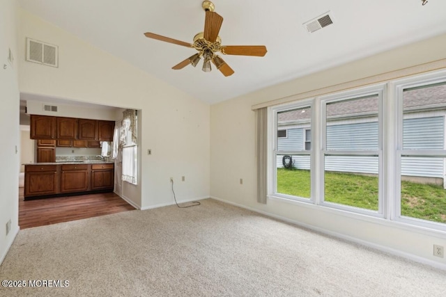 1524 Quince Pl, Toms River, NJ 08755 - unfurnished living room featuring carpet, lofted ceiling, baseboards, a ceiling fan, and a sink