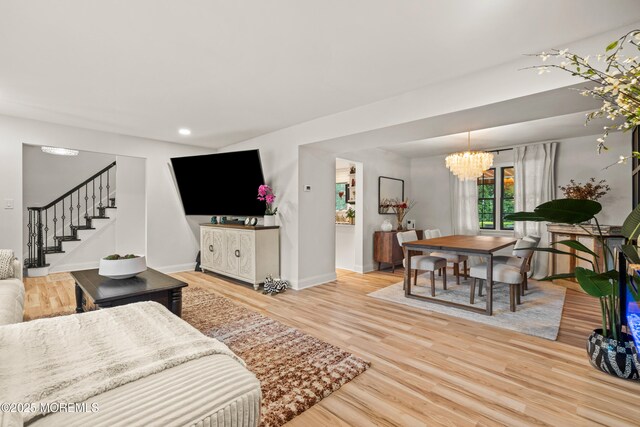 7 Carlisle Ct, Hazlet, NJ 07730 - living area featuring light wood-style flooring, a chandelier, stairs, baseboards, and recessed lighting