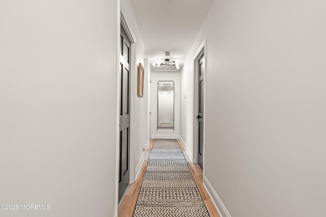 7 Carlisle Ct, Hazlet, NJ 07730 - corridor with light wood-type flooring and baseboards