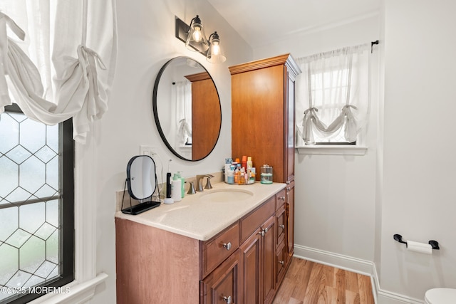 7 Carlisle Ct, Hazlet, NJ 07730 - bathroom with wood finished floors, vanity, and baseboards