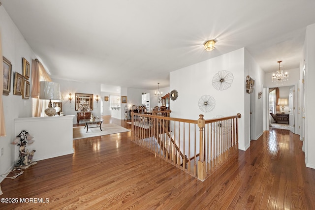 26 Masters Ct, Little Egg Harbor, NJ 08087 - hallway with a chandelier, an upstairs landing, and wood finished floors