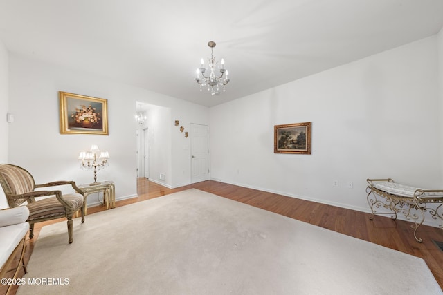 26 Masters Ct, Little Egg Harbor, NJ 08087 - living area featuring a chandelier, wood finished floors, and baseboards