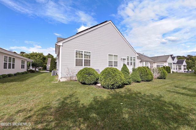 26 Masters Ct, Little Egg Harbor, NJ 08087 - view of side of home with a lawn and central AC unit