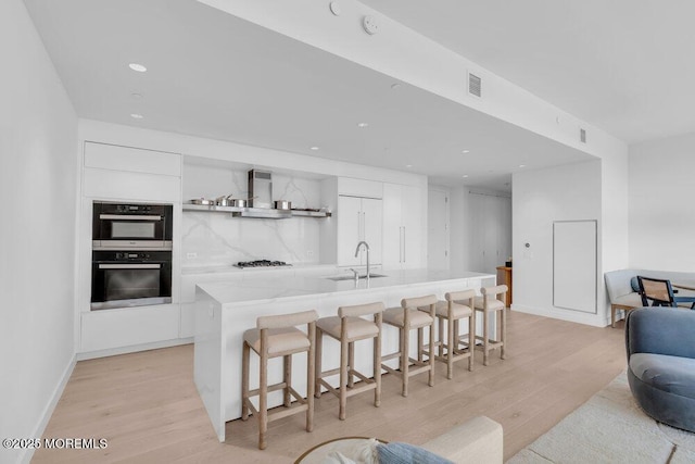 1101 Ocean Ave Unit 1403, Asbury Park, NJ 07712 - kitchen featuring a sink, modern cabinets, stainless steel appliances, white cabinets, and recessed lighting