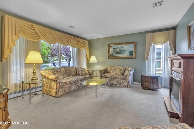 2299 Kira Ct, Toms River, NJ 08755 - carpeted living area featuring a baseboard radiator and a fireplace