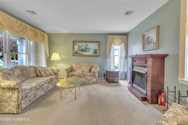2299 Kira Ct, Toms River, NJ 08755 - living area with carpet floors, baseboard heating, a glass covered fireplace, and baseboards