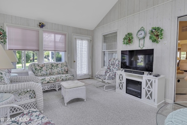 2299 Kira Ct, Toms River, NJ 08755 - carpeted living area with vaulted ceiling, plenty of natural light, and wooden walls