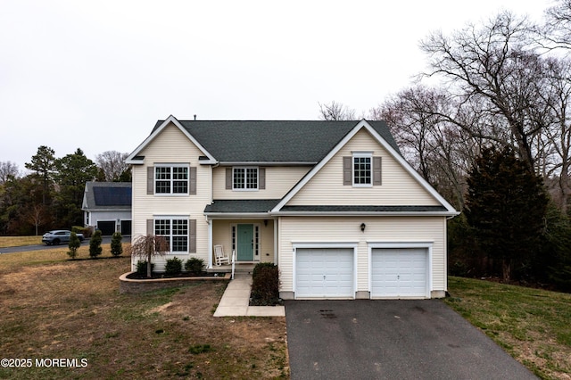 8 Maria Dr, Little Egg Harbor, NJ 08087 - traditional-style house with asphalt driveway, a garage, and a front lawn