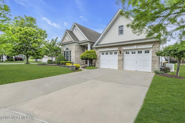 1 Lattimore Ct, Freehold, NJ 07728 - traditional home with driveway, a front lawn, an attached garage, central AC unit, and brick siding