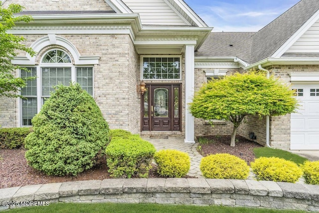 1 Lattimore Ct, Freehold, NJ 07728 - property entrance featuring brick siding and an attached garage