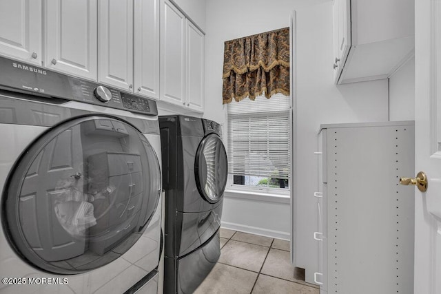 1 Lattimore Ct, Freehold, NJ 07728 - laundry area featuring cabinet space, washing machine and clothes dryer, light tile patterned flooring, and baseboards