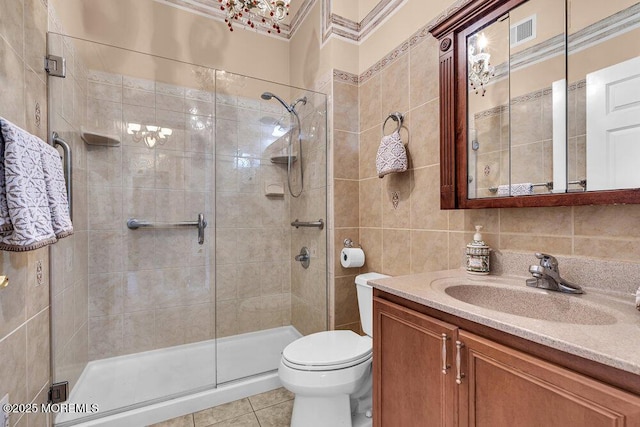 1 Lattimore Ct, Freehold, NJ 07728 - bathroom with tile walls, vanity, a stall shower, toilet, and tile patterned flooring