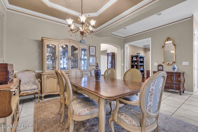 1 Lattimore Ct, Freehold, NJ 07728 - dining space with arched walkways, light tile patterned floors, a chandelier, ornamental molding, and a tray ceiling