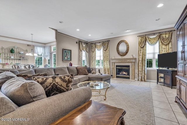 1 Lattimore Ct, Freehold, NJ 07728 - living room with ornamental molding, light tile patterned floors, a fireplace, recessed lighting, and a chandelier