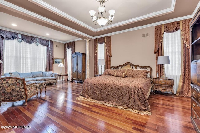 1 Lattimore Ct, Freehold, NJ 07728 - bedroom with hardwood / wood-style flooring, crown molding, a chandelier, a tray ceiling, and ornate columns