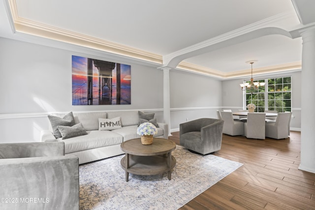 16 Wildflower Ct, Manalapan, NJ 07726 - living room featuring ornate columns, a raised ceiling, ornamental molding, and wood finished floors