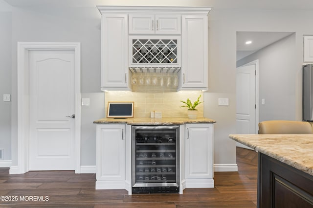 16 Wildflower Ct, Manalapan, NJ 07726 - indoor dry bar with beverage cooler, dark wood-type flooring, tasteful backsplash, recessed lighting, and baseboards
