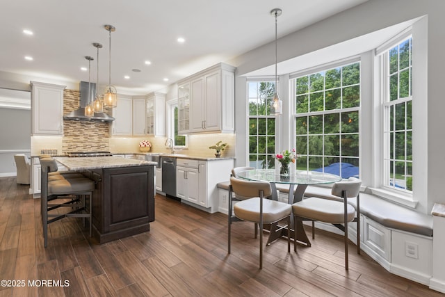 16 Wildflower Ct, Manalapan, NJ 07726 - kitchen with wall chimney range hood, dishwasher, healthy amount of natural light, dark wood-style floors, and recessed lighting