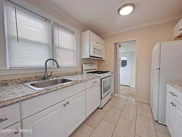 106 Delaware Ave, Atlantic Highlands, NJ 07716 - kitchen featuring white appliances, a sink, crown molding, white cabinets, and healthy amount of natural light