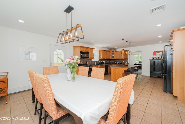 209 Woodcrest Rd, Oakhurst, NJ 07755 - dining area with light tile patterned flooring and recessed lighting