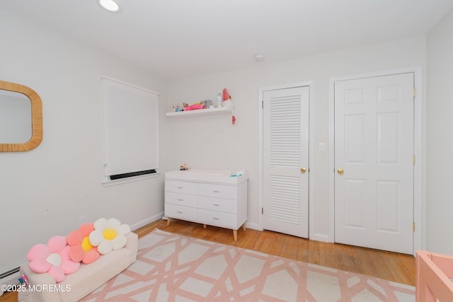 209 Woodcrest Rd, Oakhurst, NJ 07755 - playroom featuring light wood finished floors, baseboards, and recessed lighting