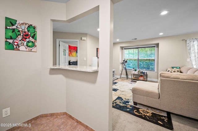 living room with baseboards and recessed lighting