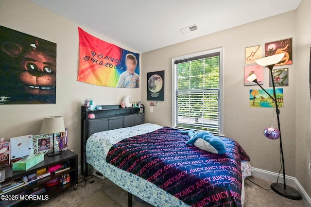 bedroom featuring carpet flooring and baseboards