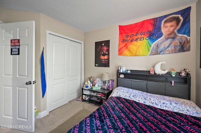carpeted bedroom featuring a closet