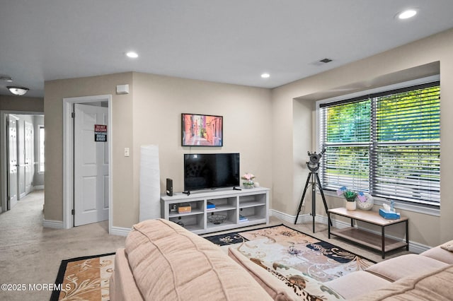 living room with baseboards, recessed lighting, and carpet floors