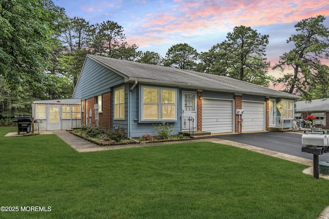 11 Lexington Dr Unit A, Whiting, NJ 08759 - single story home with asphalt driveway, a garage, a front lawn, and roof with shingles