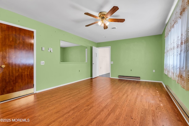 11 Lexington Dr Unit A, Whiting, NJ 08759 - unfurnished room with baseboard heating, a ceiling fan, and wood finished floors