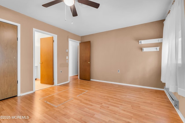 11 Lexington Dr Unit A, Whiting, NJ 08759 - unfurnished bedroom with light wood finished floors, baseboard heating, baseboards, ensuite bath, and ceiling fan