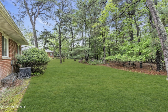 11 Lexington Dr Unit A, Whiting, NJ 08759 - view of green lawn with central AC unit